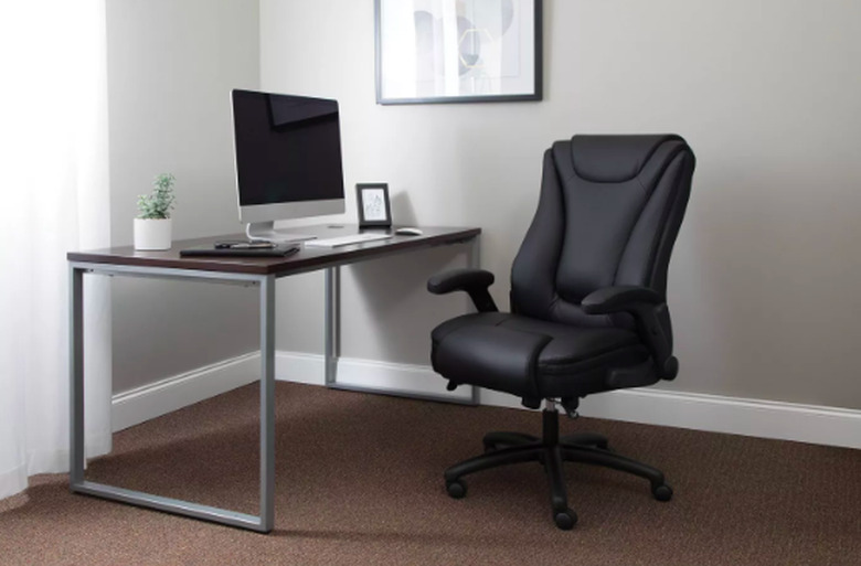 desk with monitor and ergonomic black chair