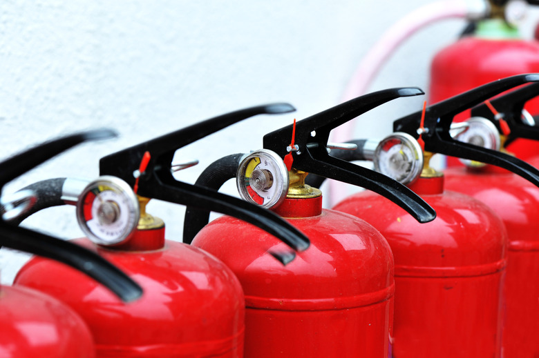 Red fire extinguishers lined up