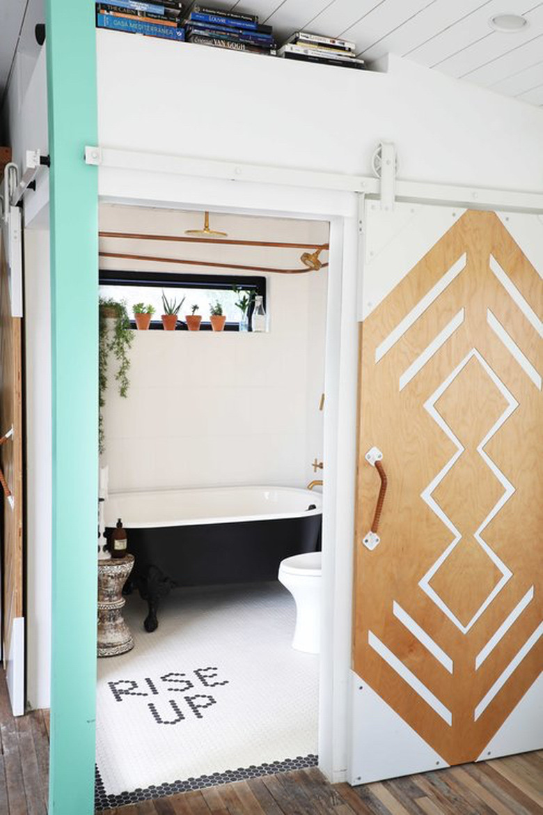 bathroom with mosaic word tile flooring