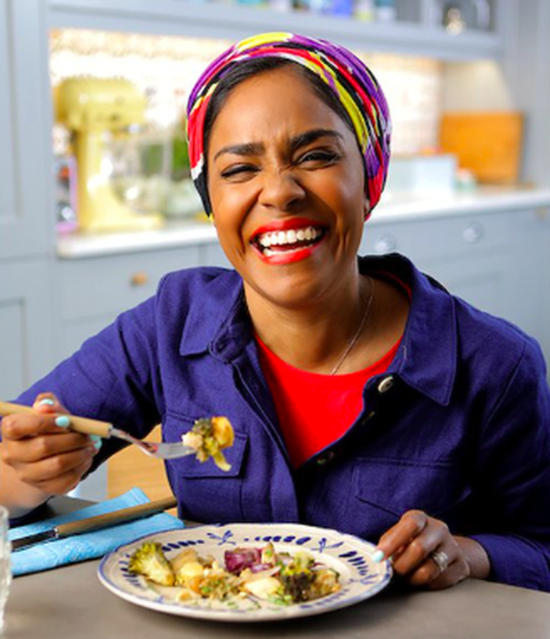 woman laughing and eating