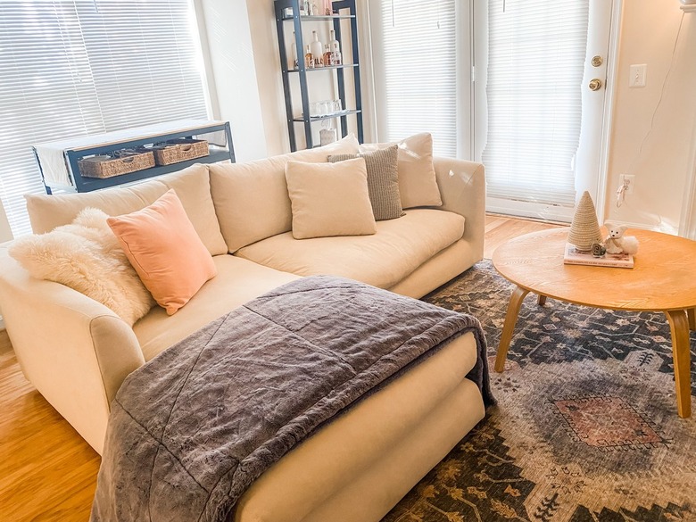 lovesac blanket draped over a sofa