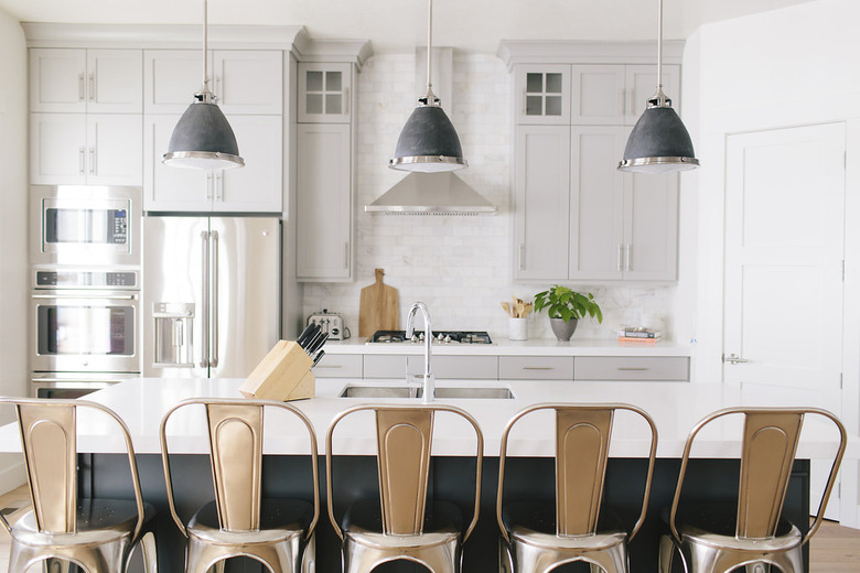 kitchen with gray cabinets and dark gray island