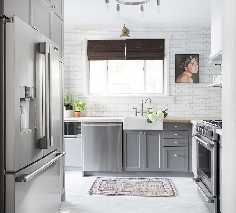 gray kitchen cabinets and white subway tile