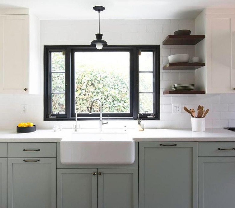 neutral kitchen with gray lower cabinets, farmhouse sink under a window