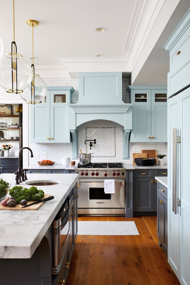 white kitchen with gray and blue cabinets