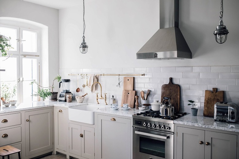 gray kitchen cabinets with stainless steel appliances