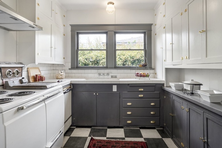 gray and white kitchen with checkered floor