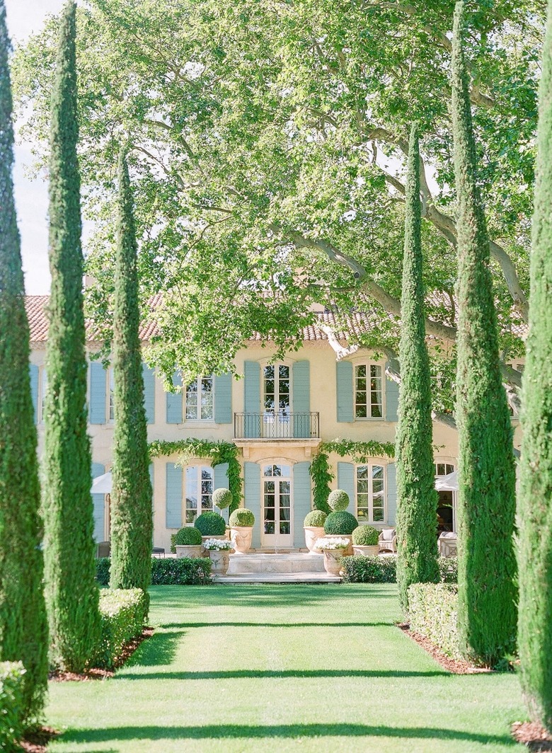 French country exterior with landscaping