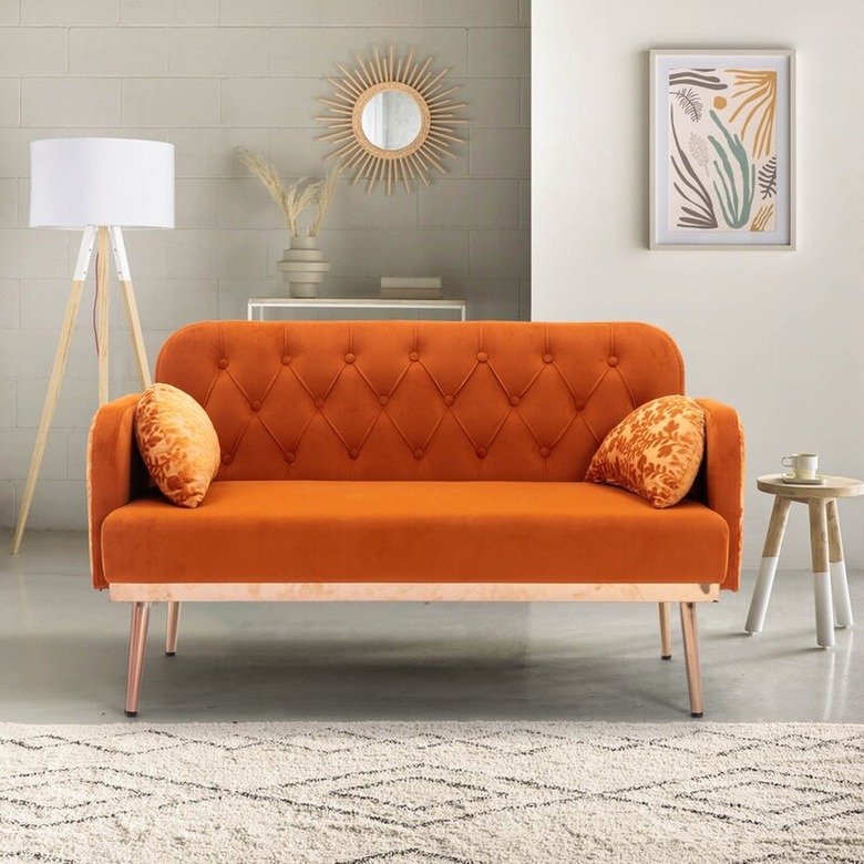 Orange velvet sofa