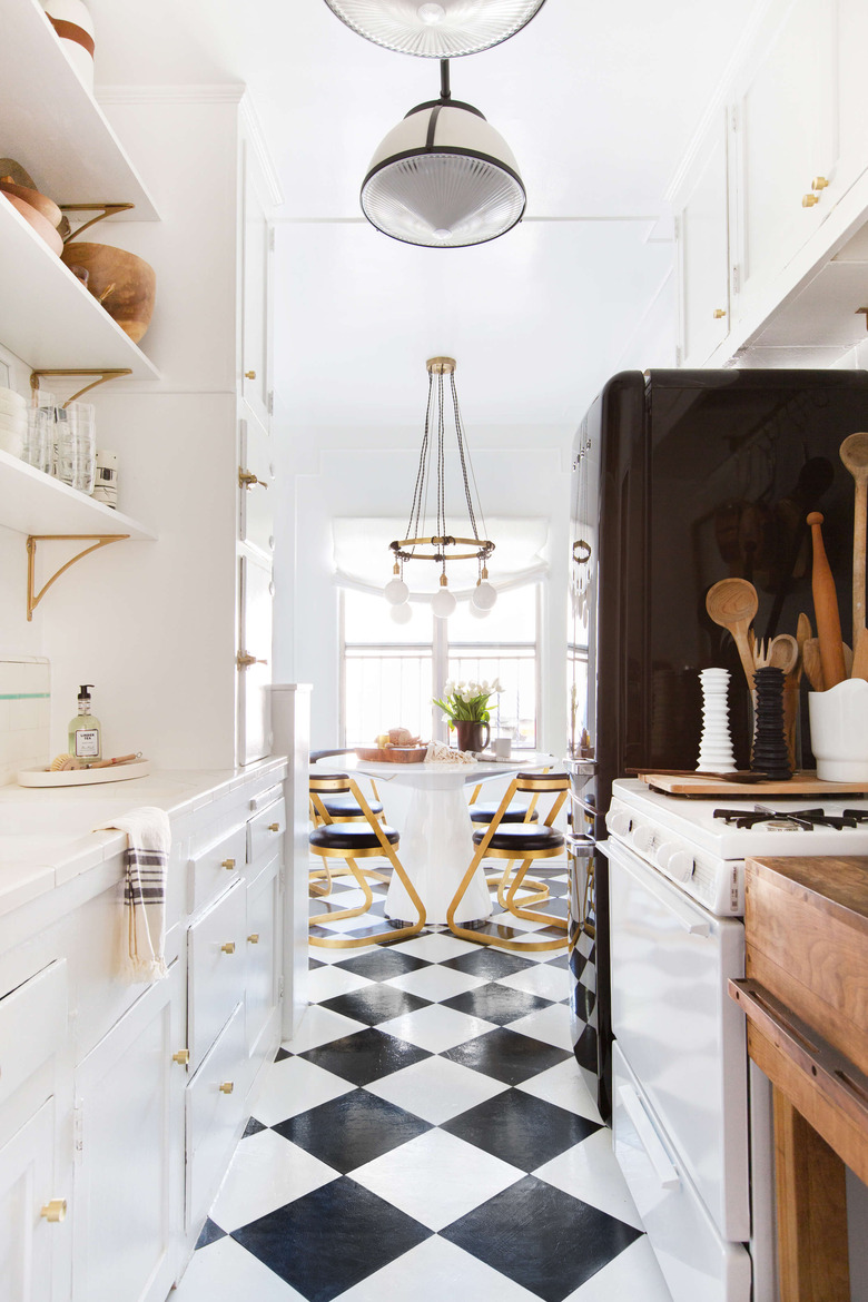 black and white galley kitchen with open shelving