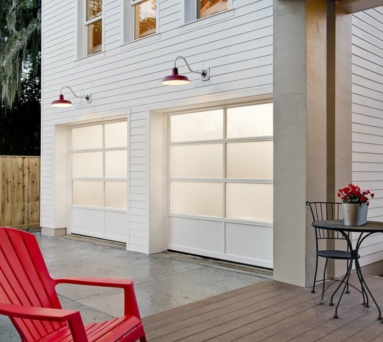 white garage door colors on white contemporary house with red chair.