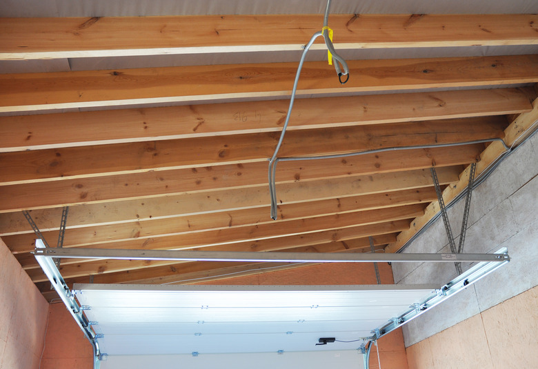 Garage Door Post Rail and Spring Installation Assembly Garage Ceilling.