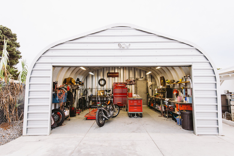 Garage Organization Tips and Tricks with motorcycle and red storage