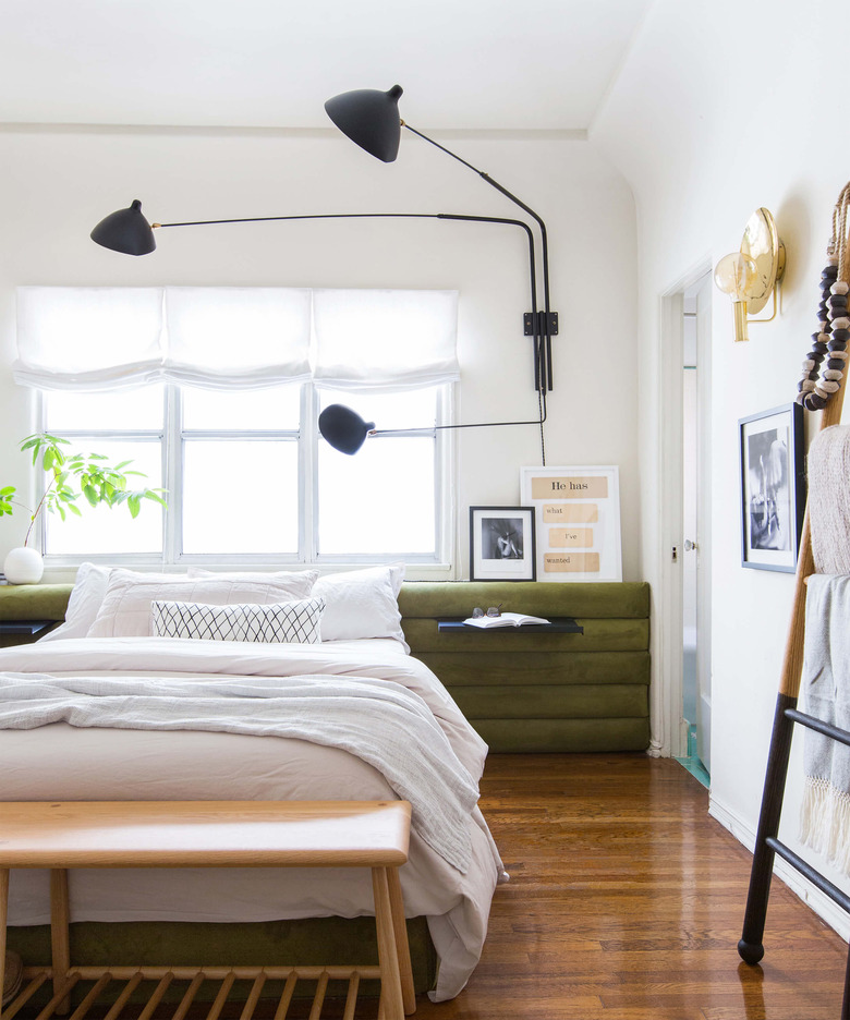 teen bedroom idea with channel tufted headboard and modern wall sconce