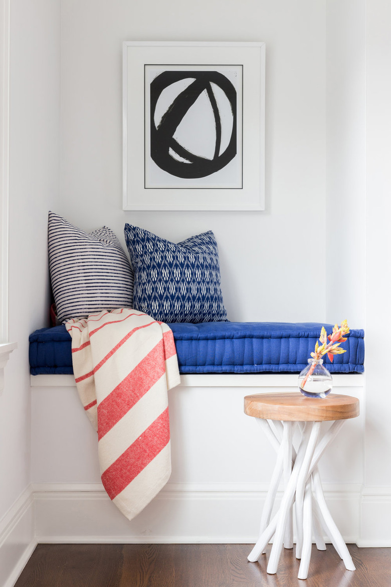 teen bedroom idea with reading nook complete with cushion, pillows, and blanket