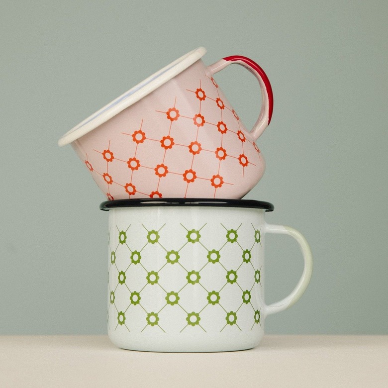 two enamel mugs in floral patterns