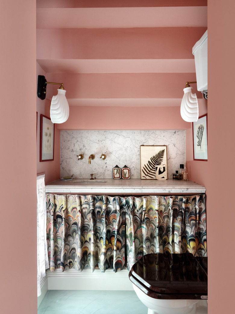 bathroom space with pink walls