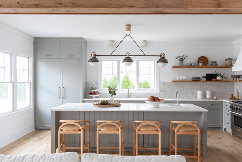 gray and white kitchen with white countertops