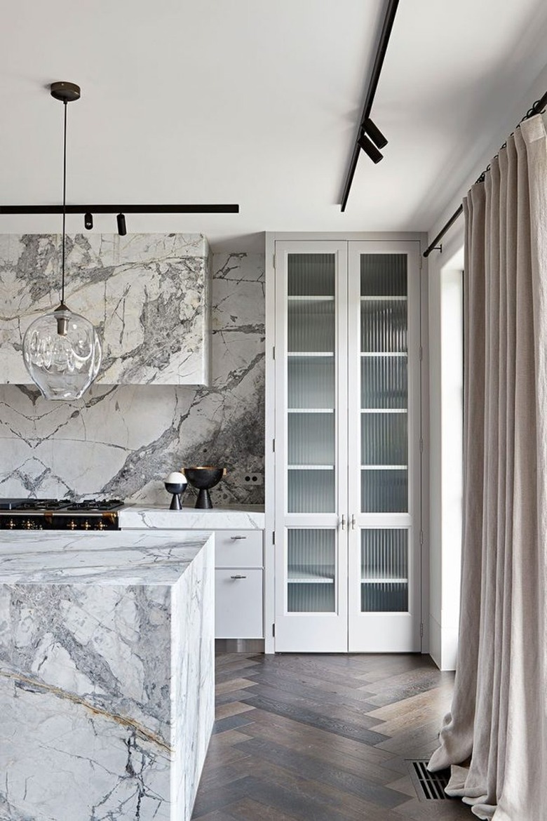 gray and white kitchen with marble