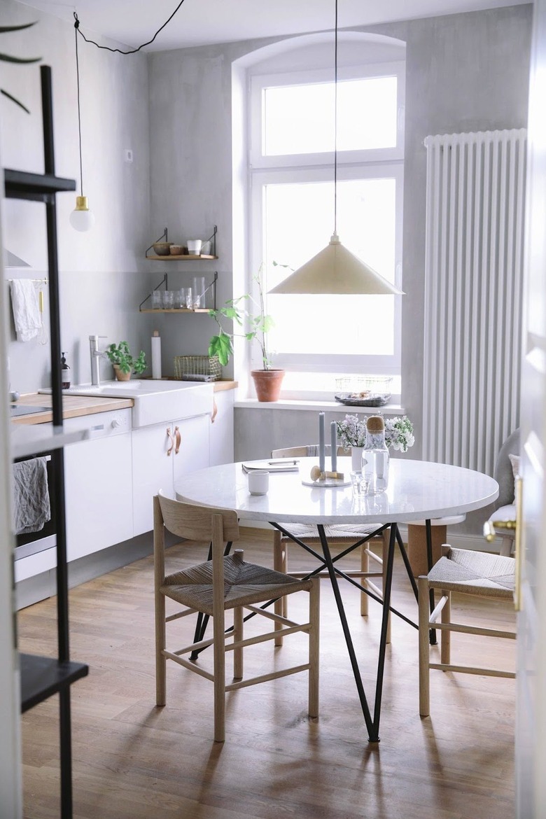 gray and white kitchen with plaster walls