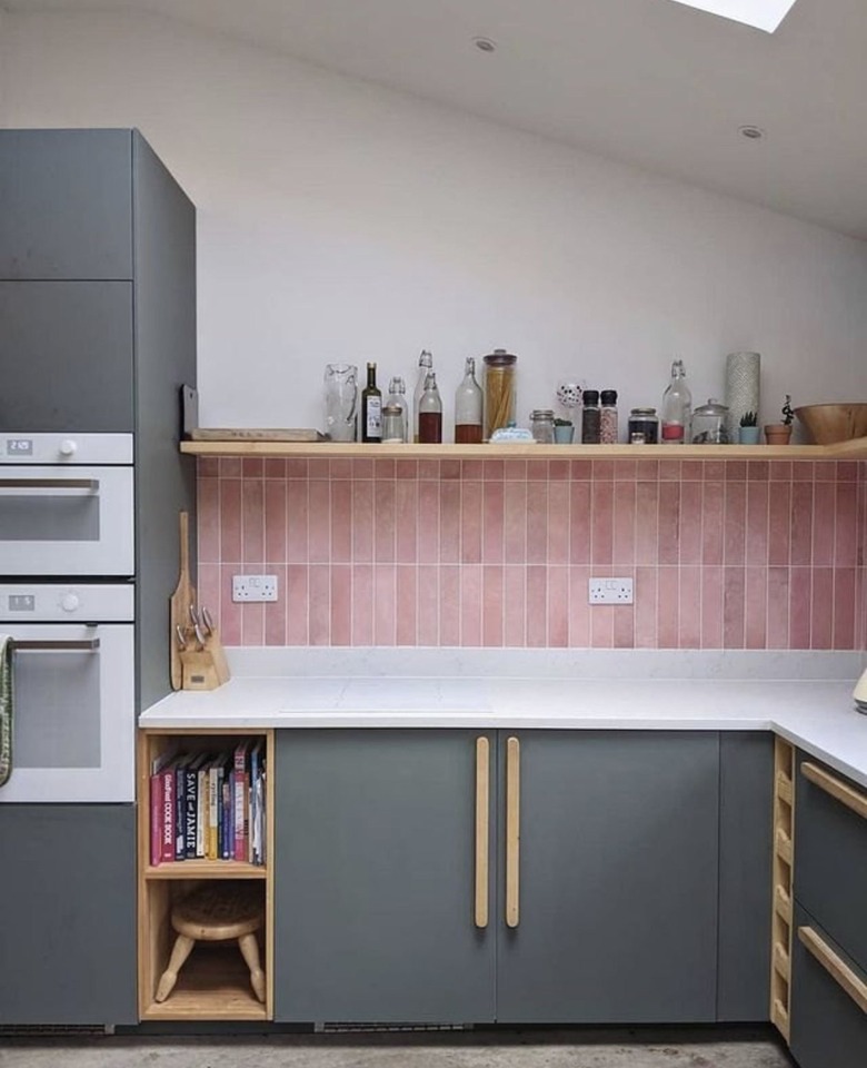 gray and white kitchen with pink backsplash