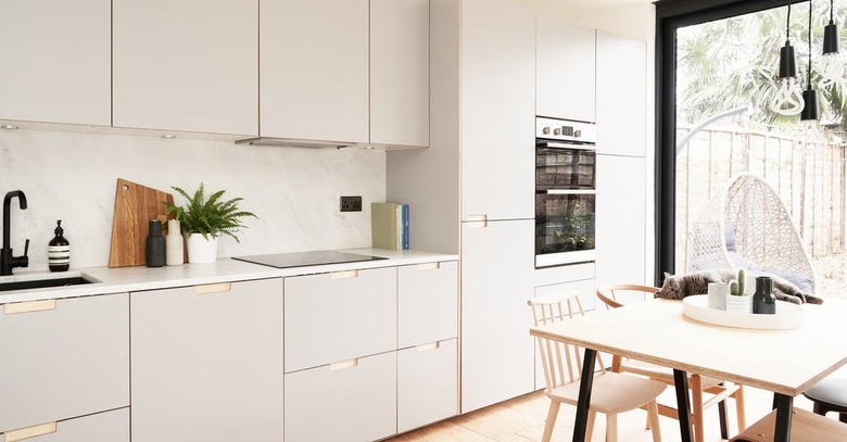 moden gray and white kitchen with flat panel cabinets