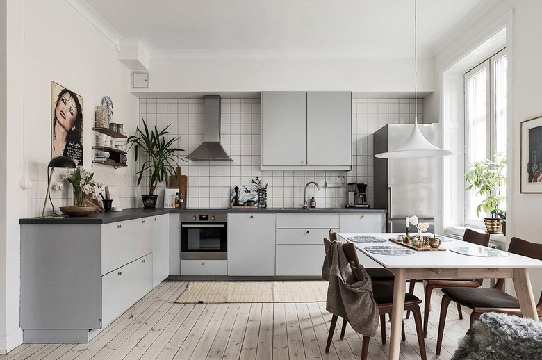 gray and white kitchen with stainless steel appliances