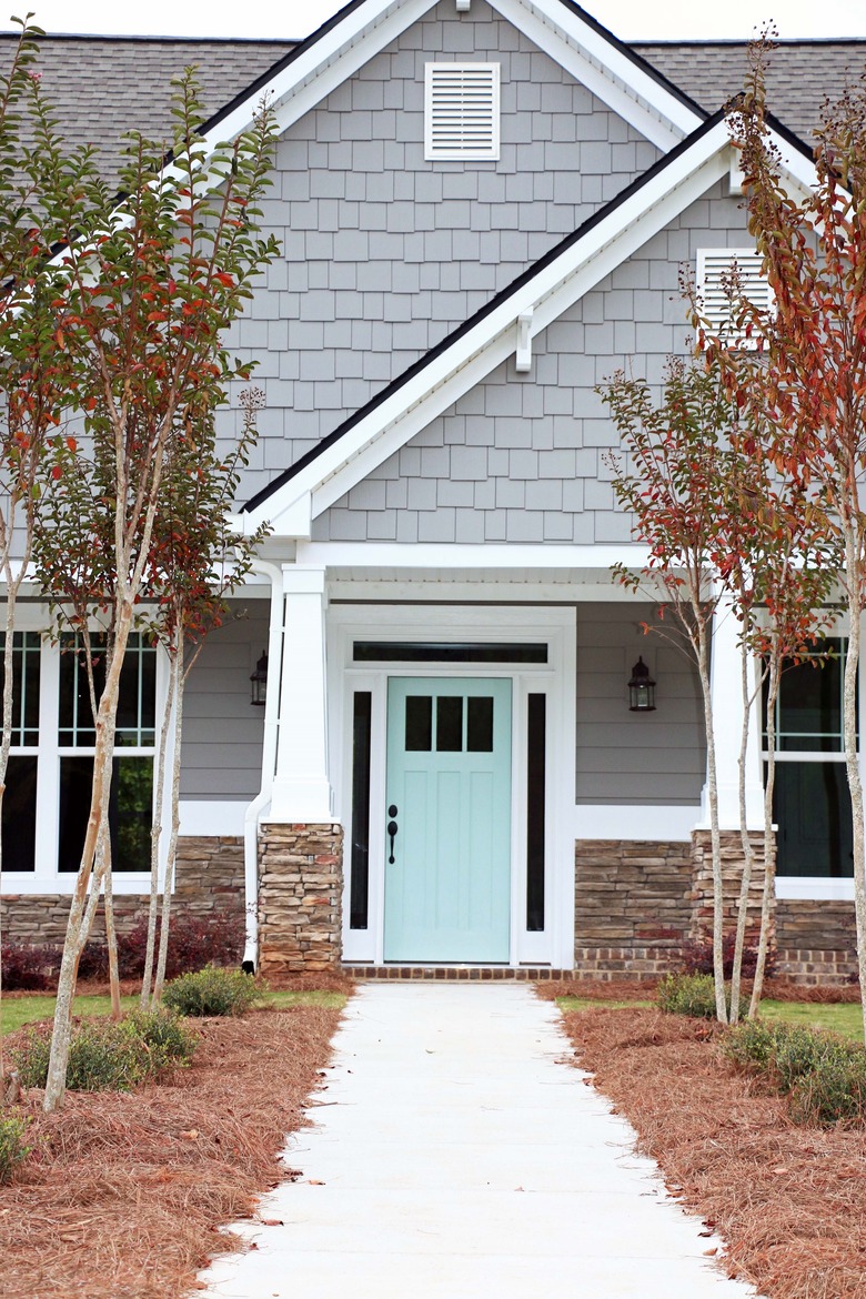 gray exterior paint with turquoise front door