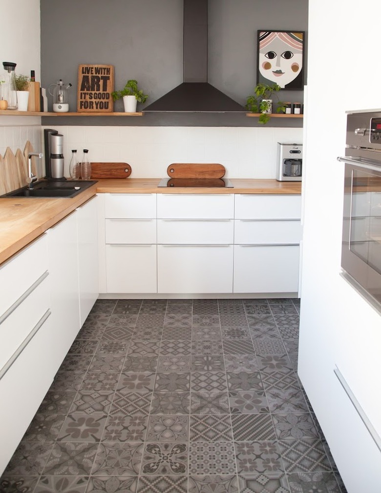 white and gray kitchen with gray encaustic tiles