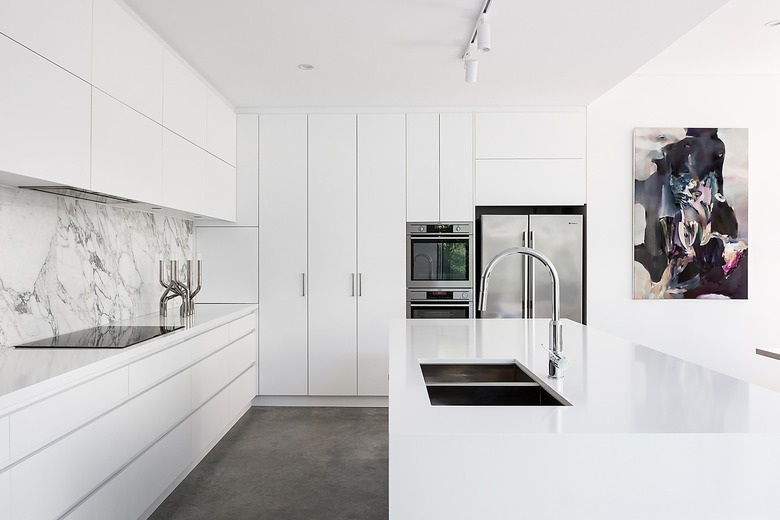 minimal white kitchen with dark gray floor