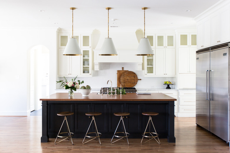 wood paneled gray kitchen island in modern white kitchen