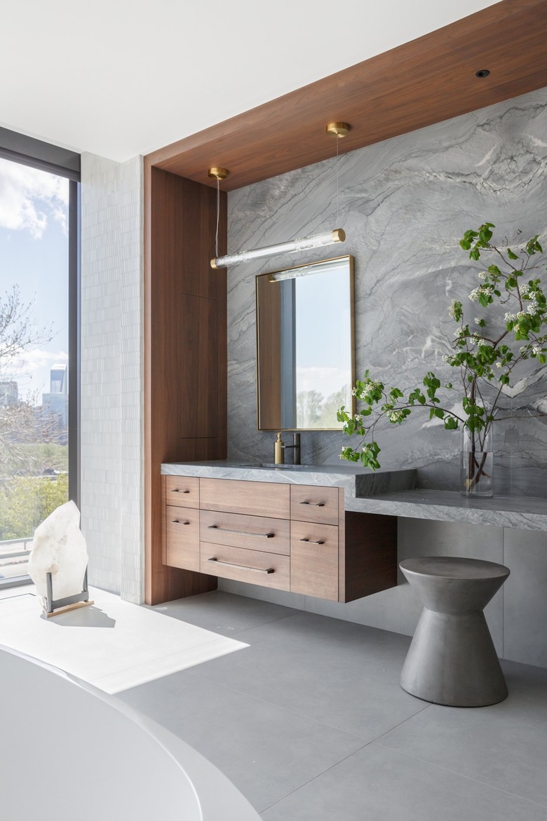 Gray room with walnut floating cabinet and frame