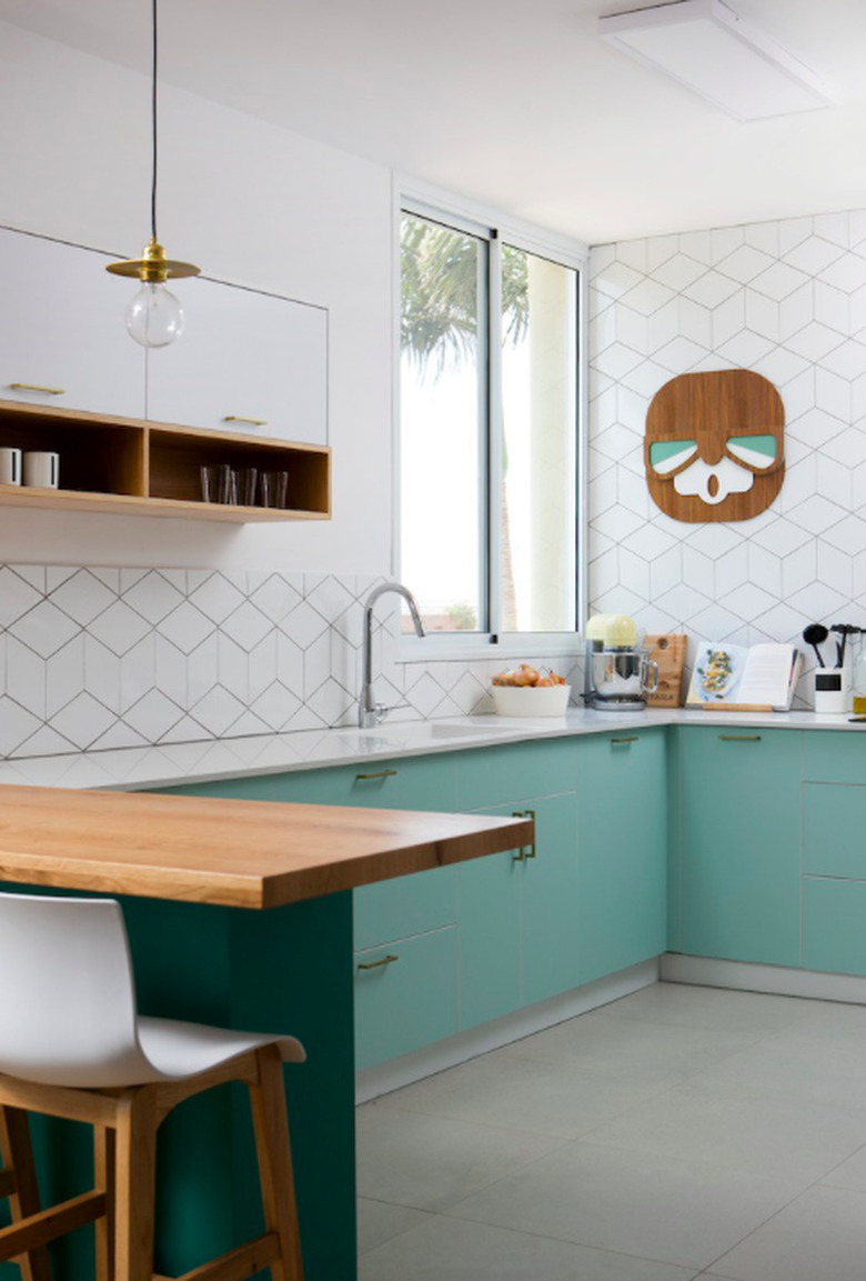 modern kitchen with light green cabinets