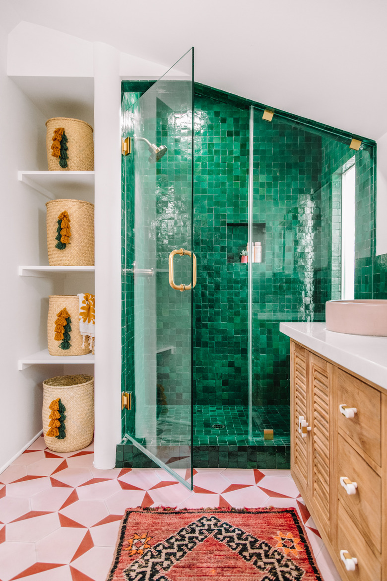 Green tile shower in emerald green with pink and orange floor tiles