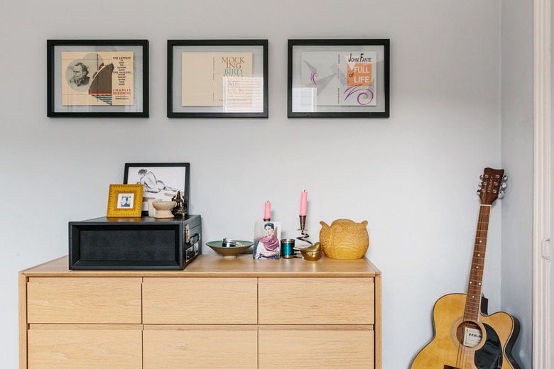 Gray color idea with wood cabinet and guitar