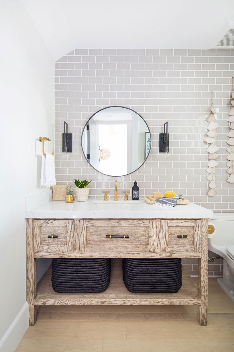 half bathroom idea with gray subway tile and wood vanity cabinet