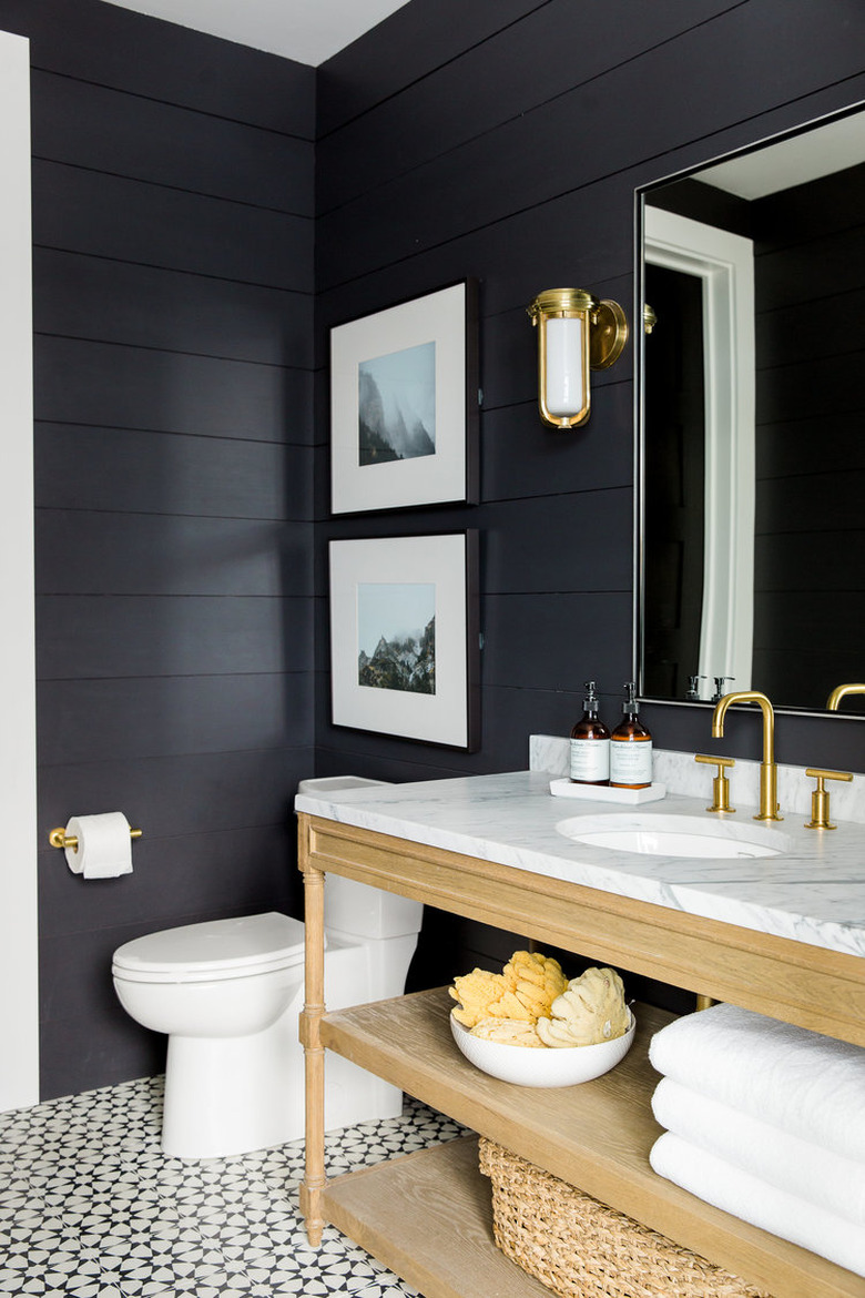 half bathroom idea with black shiplap walls and patterned floor tile