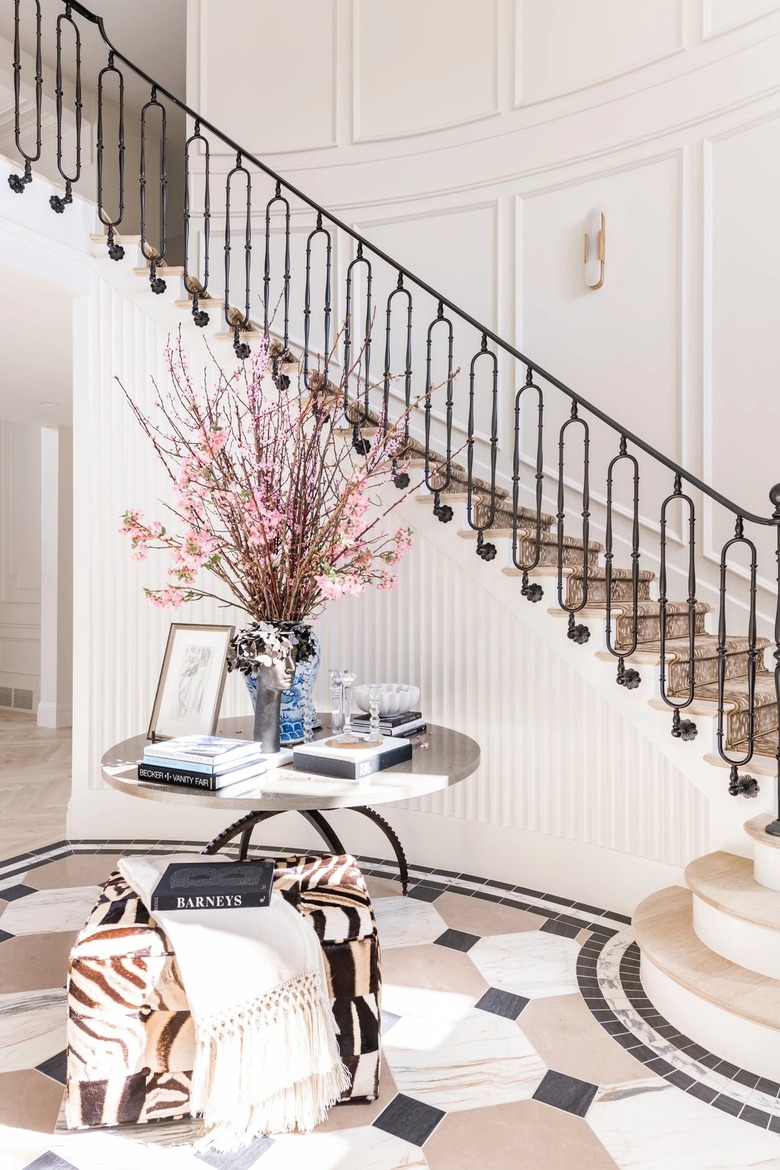 marble table and staircase in entryway