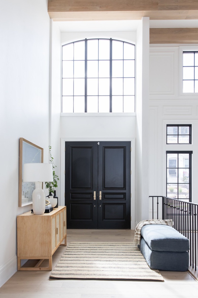 credenza and ottoman in entryway