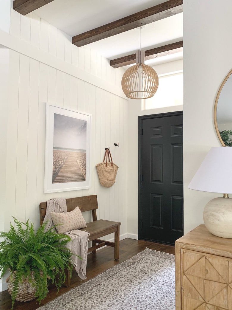 beach artwork and bench in entryway