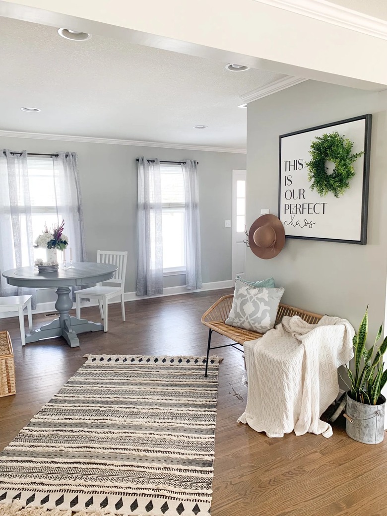 farmhouse entryway with bench and rug