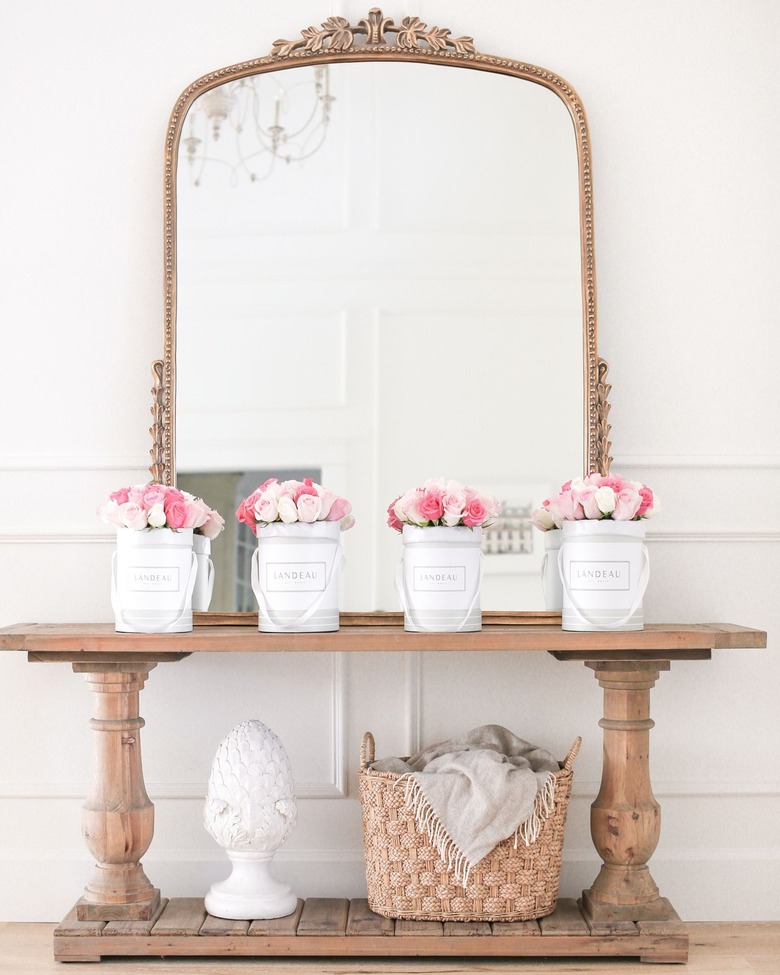 large antique inspired mirror in entryway