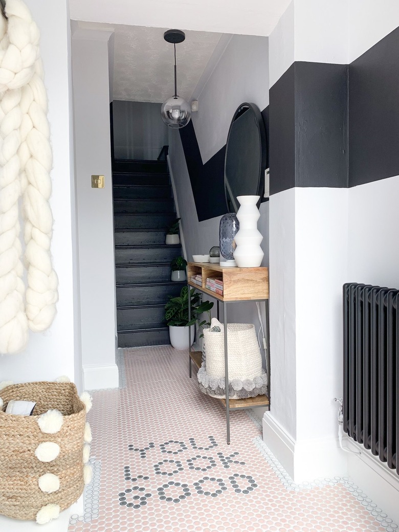 tiled floor and painted mural in entryway