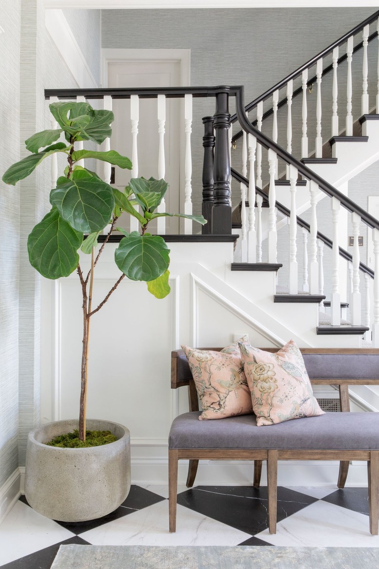 purple upholstered bench in entryway