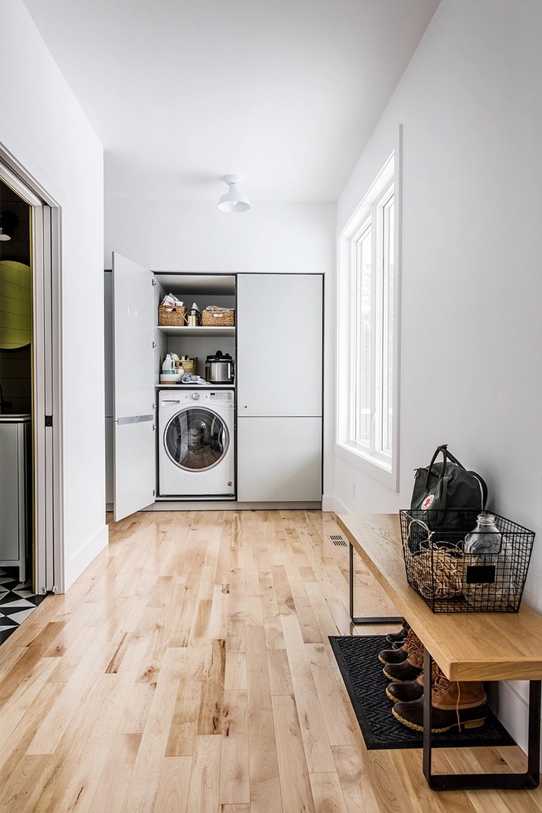 laundry area and bench in entryway