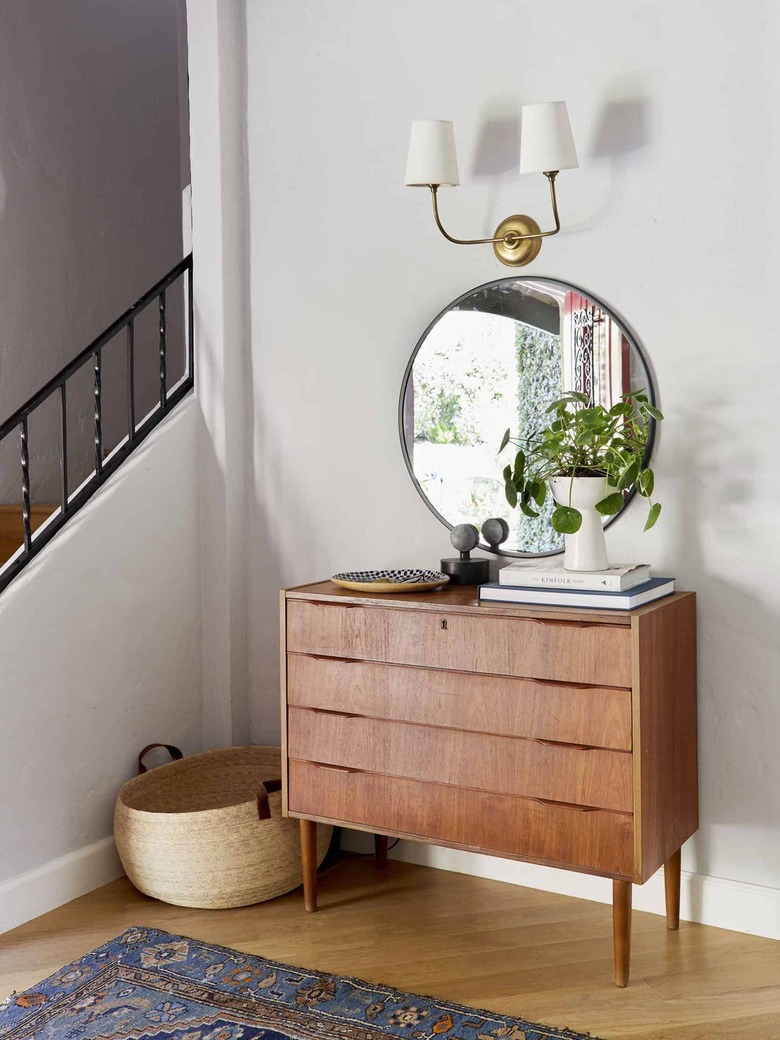 midcentury dresser and mirror in entryway