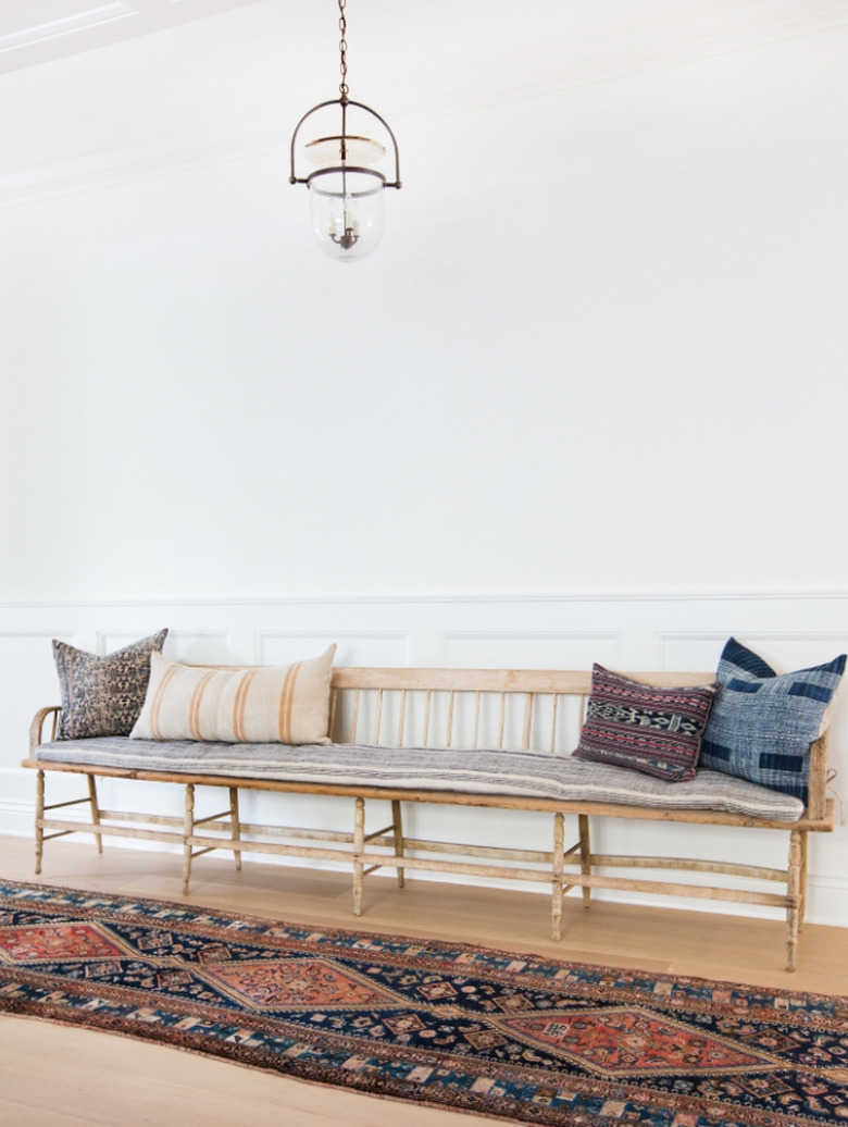 Hallway Pendant Light in Hallway with bench, runner, pillows, bell jar pendant.