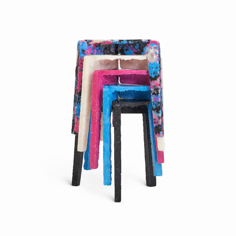 stack of stools in various colors