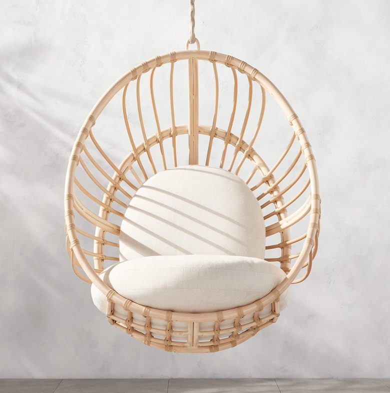 Rattan swinging chair.