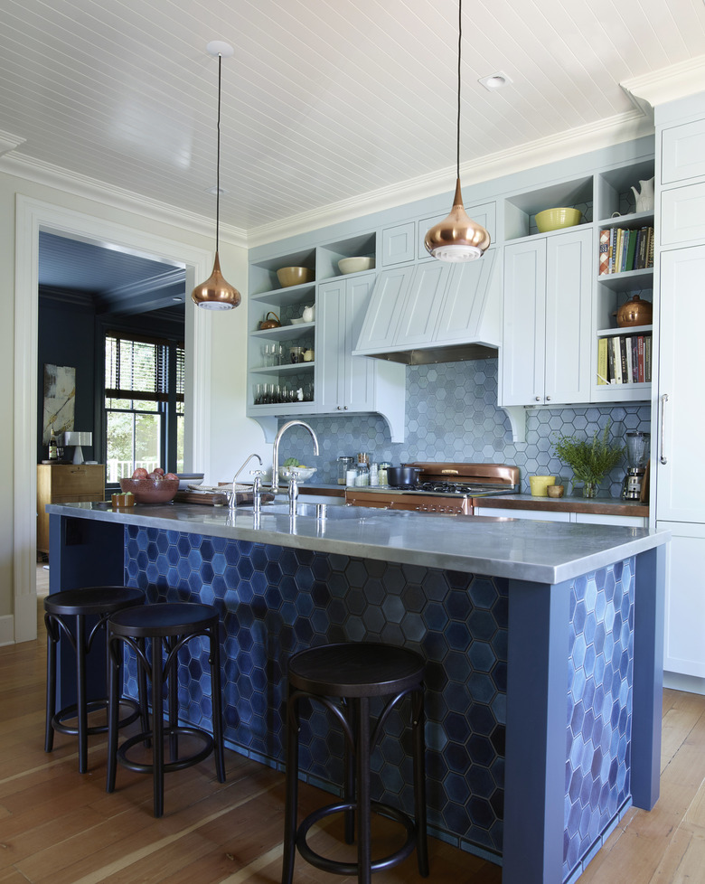 Contemporary kitchen with different shades of blue hexagon heath tile and kitchen island